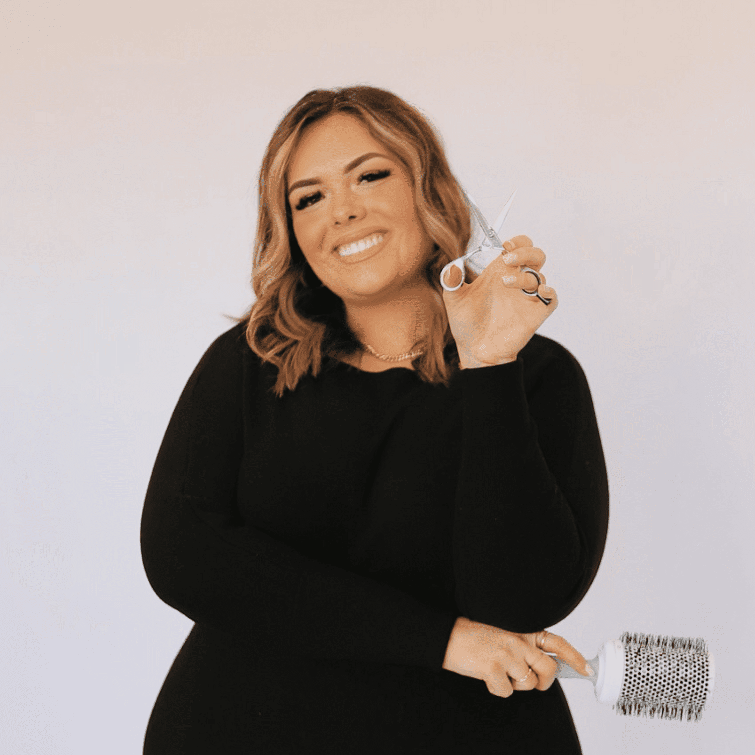 Portrait of Samantha, a professional stylist at Shairon's Salon, showcasing their expertise and style.